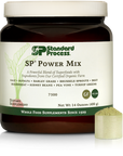 Tub of SP Power Mix next to a scoop of the green powder.