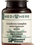 A bottle of Cranberry Complex next to a tablet.