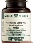 A bottle of Cranberry Complex next to a tablet.